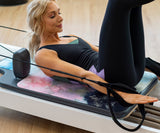 REFORMERMAT Female Practising Reformer Pilates On Durable Micro-fibre Gym Mat